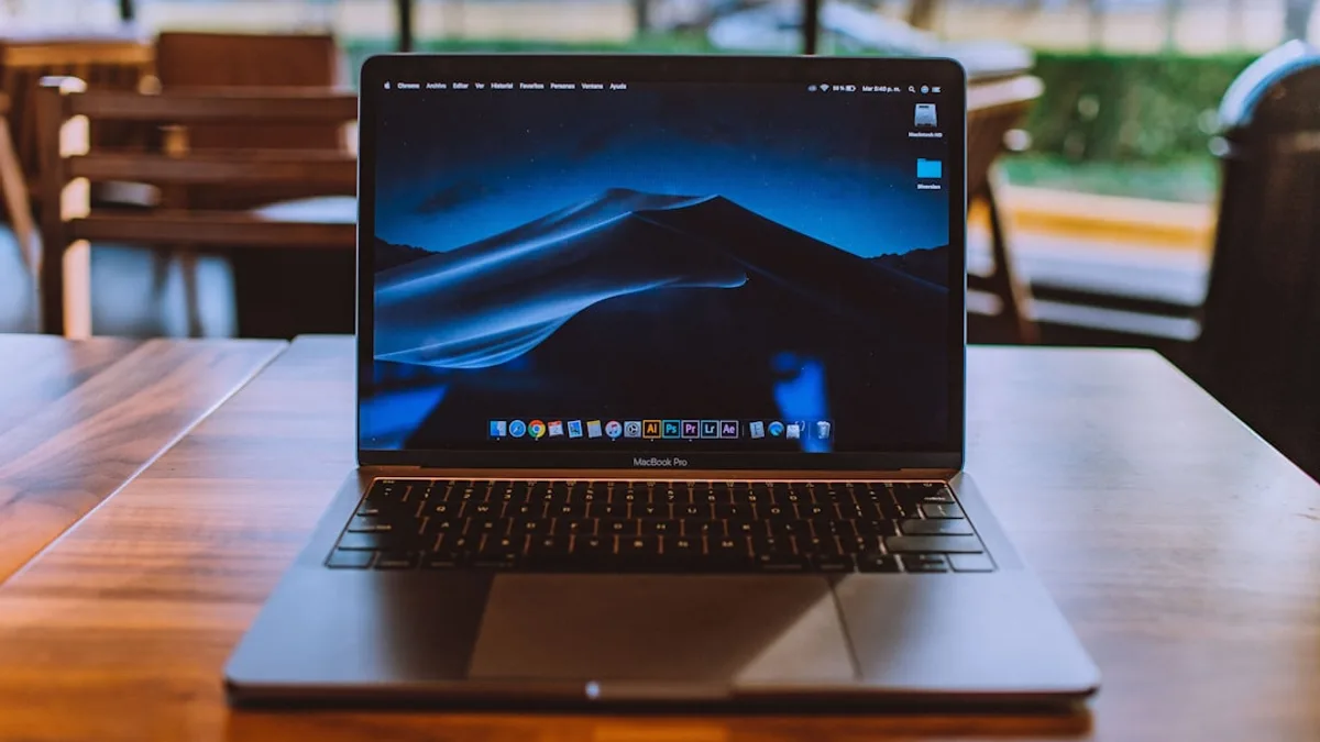 MacBook Pro on brown wooden surface
